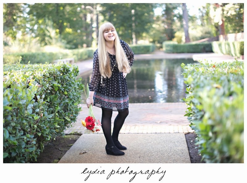 Infront of a pond for vintage fashion senior portraits at Empire Mine in Grass Valley, California