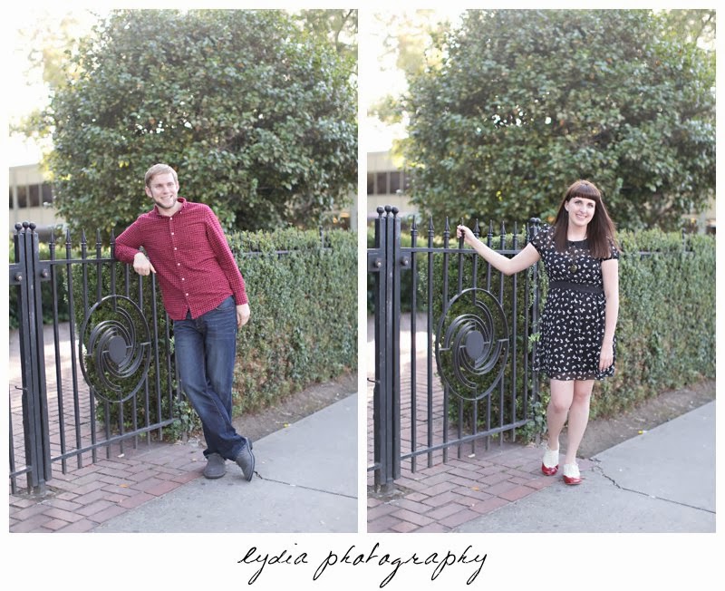 Bride and groom at a fence for engagement portraits in downtown Sacramento, California