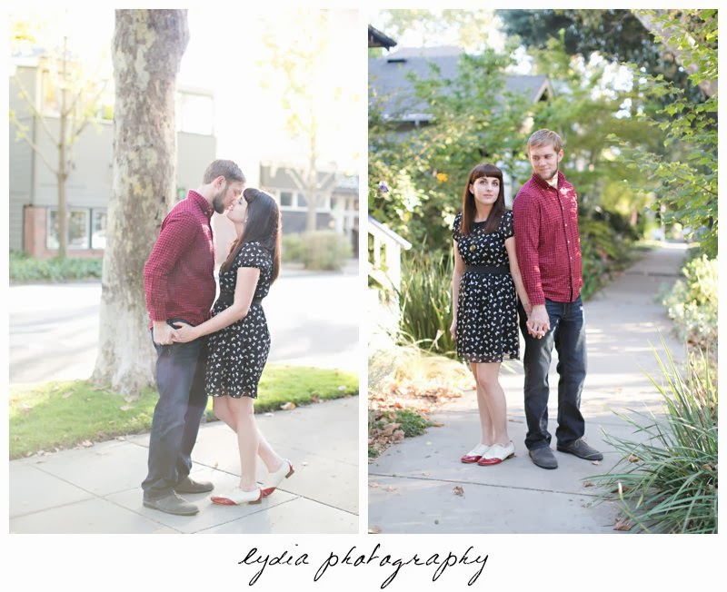 Bride and groom kissing for engagement portraits in downtown Sacramento, California