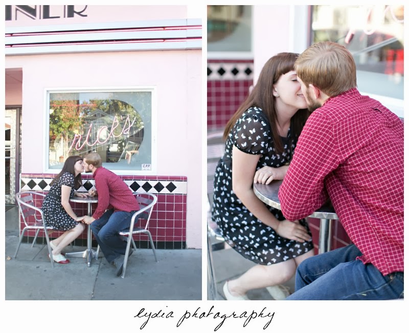 Bride and groom sitting for engagement portraits in downtown Sacramento, California
