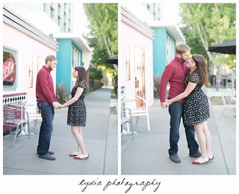Bride and groom infront of ricks diner for engagement portraits in downtown Sacramento, California