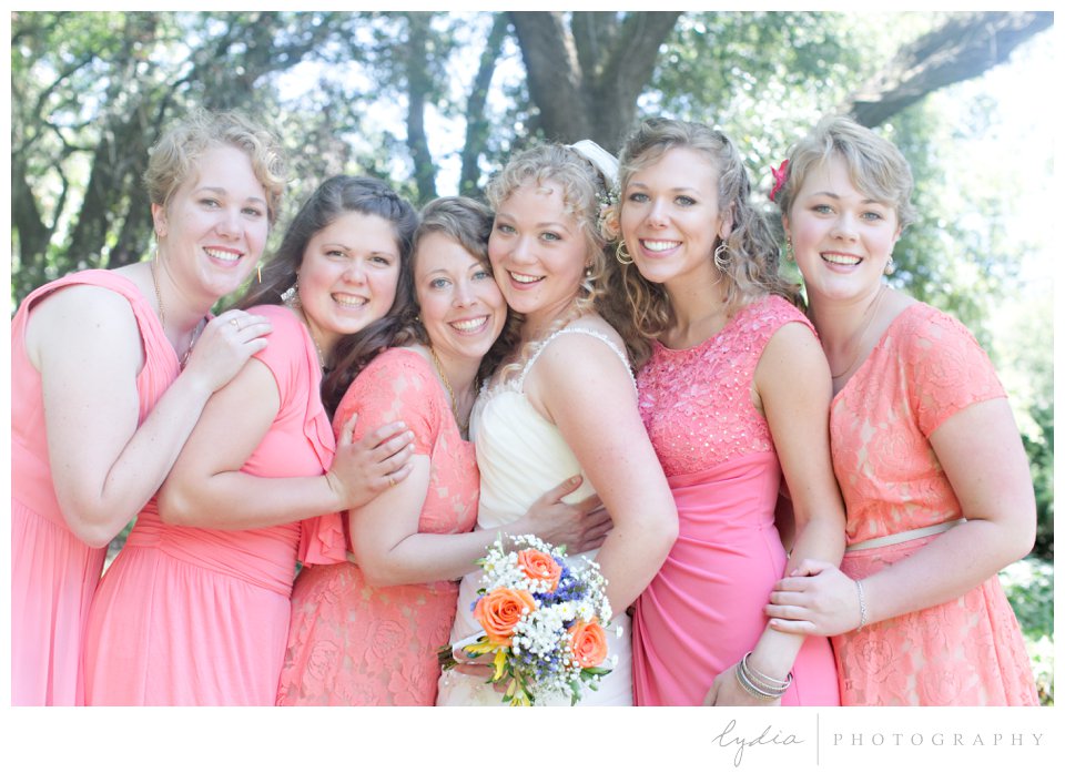 Bridesmaides in coral dresses with bride at ethereal wedding in Santa Rosa, California