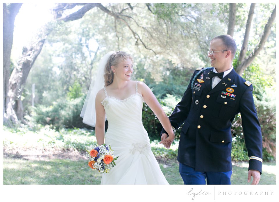 Bride and groom in army dress blues laughing at ethereal wedding in Santa Rosa, California