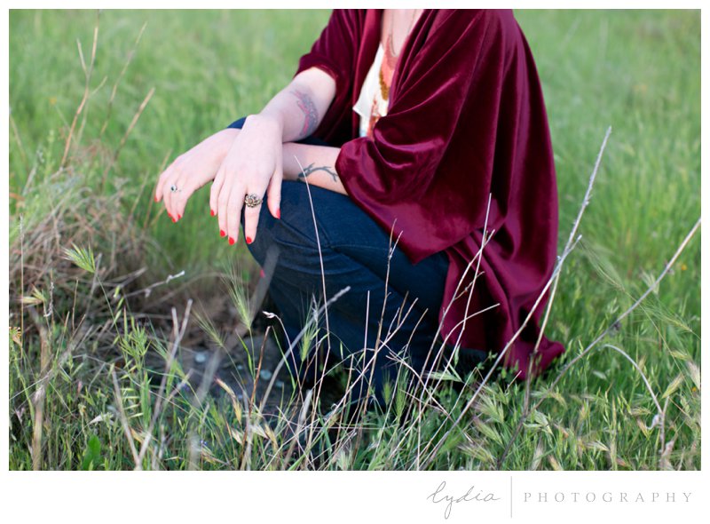 Anthropologie styled senior wearing a red kimono in a field in Roseville, California.