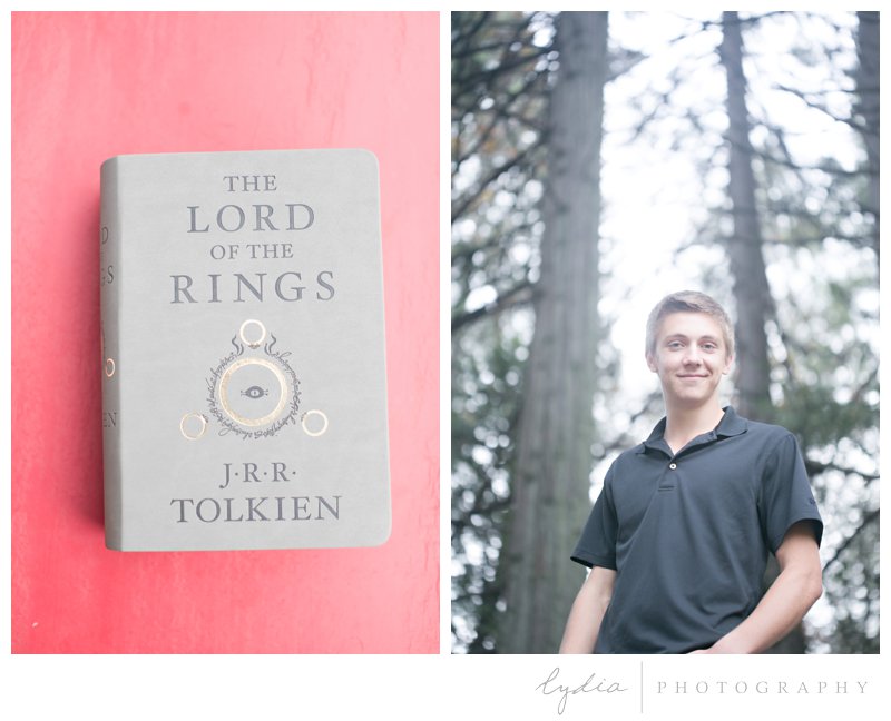 The Lord of the Rings Book with senior guy in the forest for high school Ghidotti senior portraits at Little Deer Creek Trail in Nevada City, California