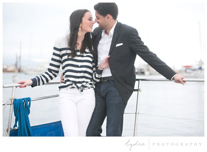 Bride and groom looking at each other for a nautical engagement styled inspiration portraits in Santa Barbara, California.