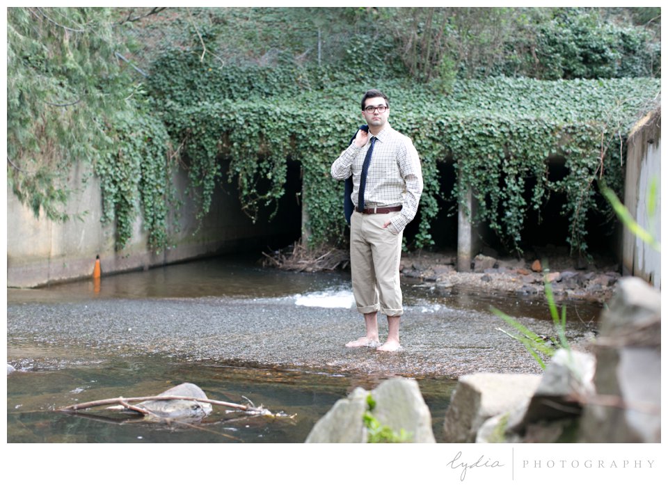UNC senior by the river for grad portraits at the river in Grass Valley, California.