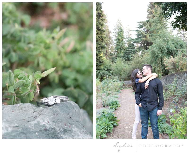 Bride and groom in rose garden and engagement ring at Empire Mine engagement portraits in Grass Valley, California.