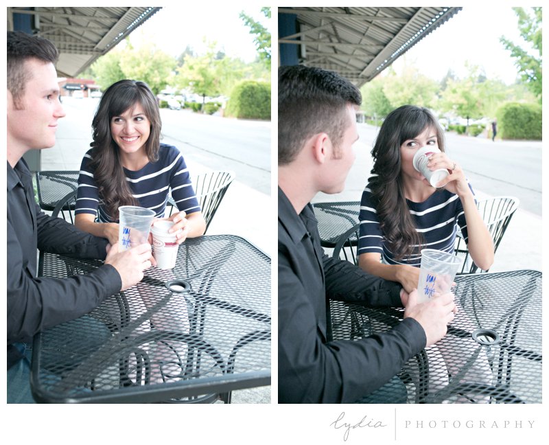 Bride and groom flirting at Caroline's Coffee Roasters at engagement portrait session in downtown Grass Valley, California.