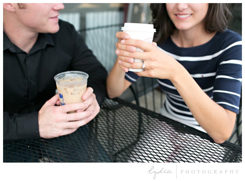 Bride and groom drinking coffee at Caroline's Coffee Roasters at engagement portrait session in downtown Grass Valley, California.