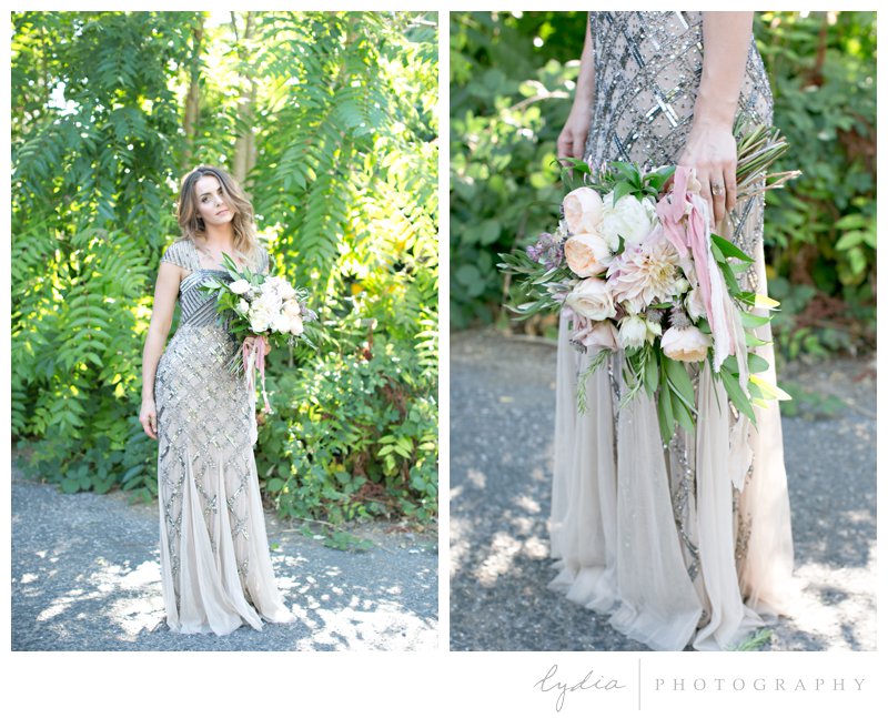 Bride holding bouquet in Adrianna Papell dress at Old World Italy wedding at Miners Foundry in Nevada City, California.