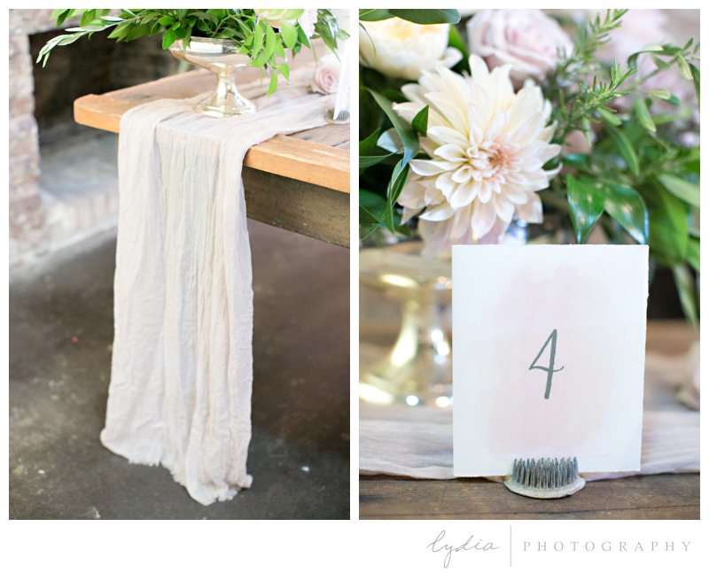 Table linen and reception number sign at Old World Italy wedding.