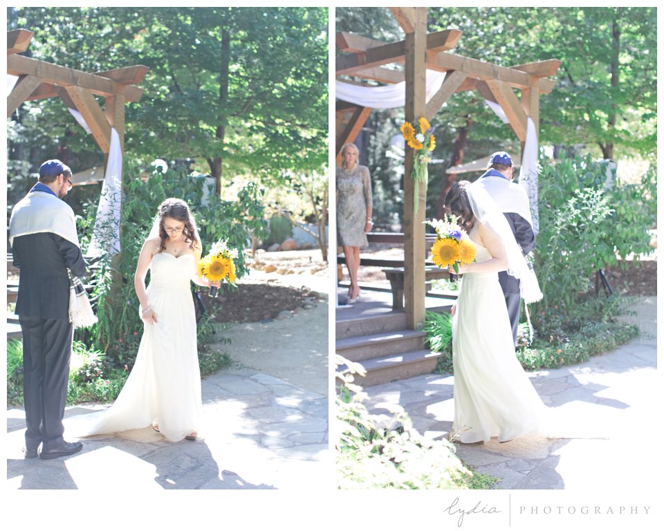 Bride circling the groom at Harmony Ridge Lodge Jewish wedding in the Tahoe National Forest in California.
