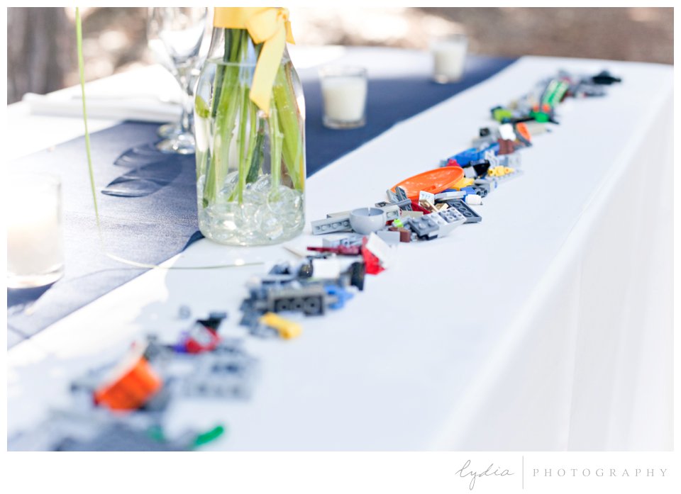 Legos lining the table at Harmony Ridge Lodge Jewish wedding in the Tahoe National Forest in California.