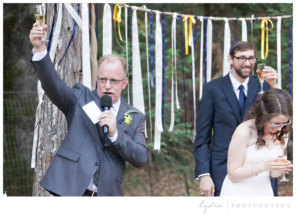 Father of the bride toasting at Harmony Ridge Lodge Jewish wedding in the Tahoe National Forest in California.