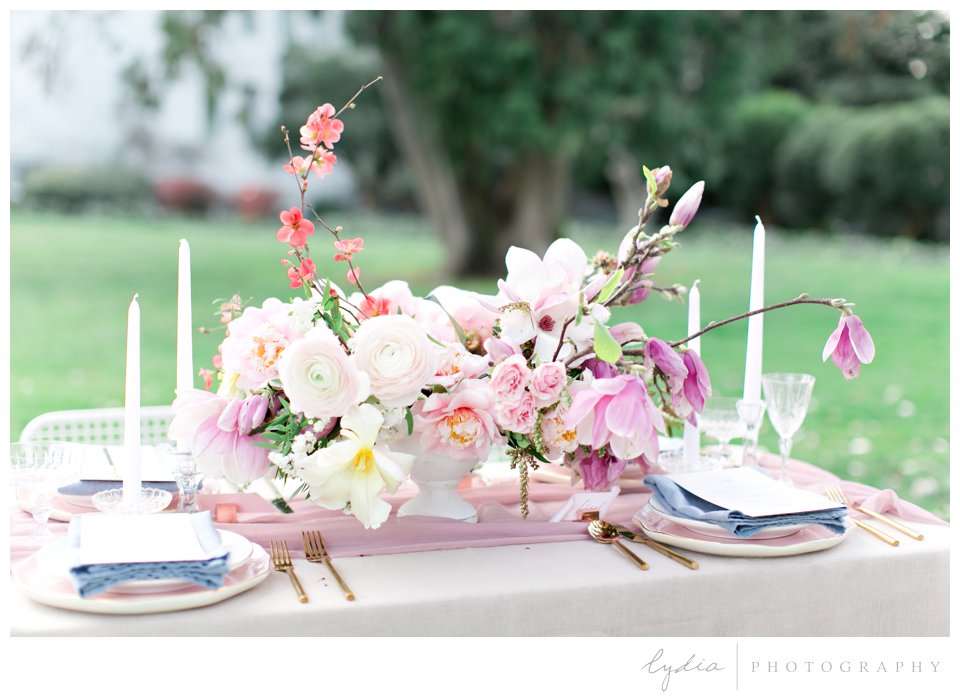 Floral reception centerpiece at California capitol in film wedding photography.