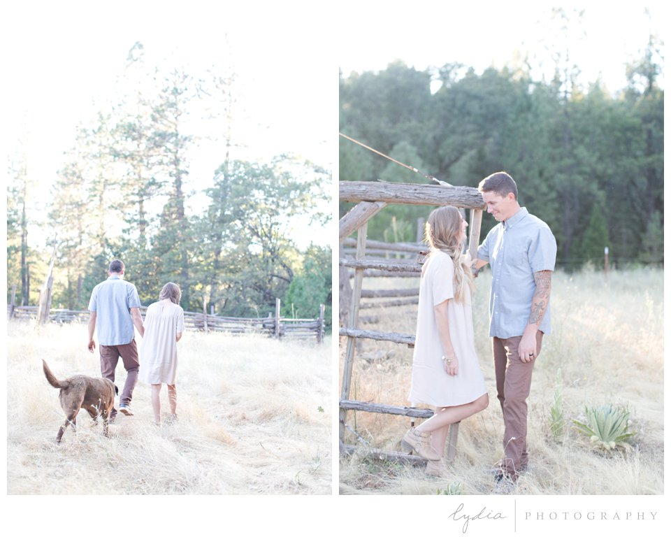 Wife and husband walking in field at Smith Vineyard wedding anniversary portrait shoot in Grass Valley, California.