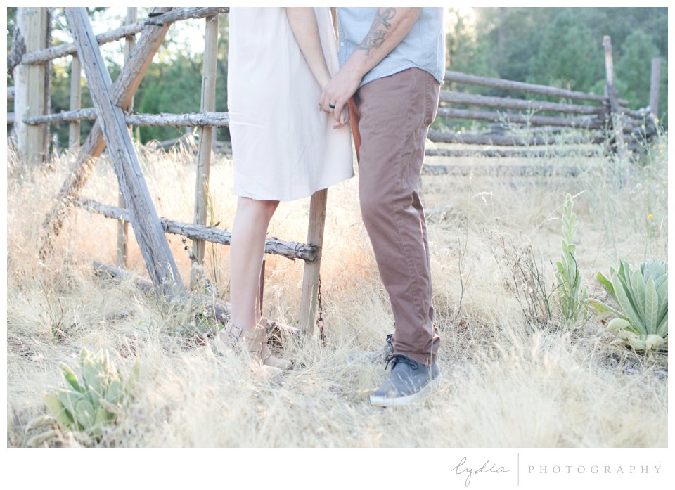 Holding hands at Smith Vineyard wedding anniversary portrait shoot in Grass Valley, California.