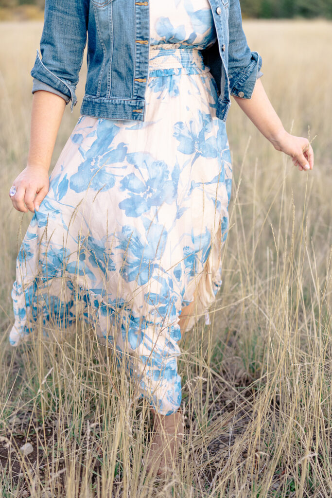 Close up of teen girl walking in meadow at Nevada City senior portrait session.