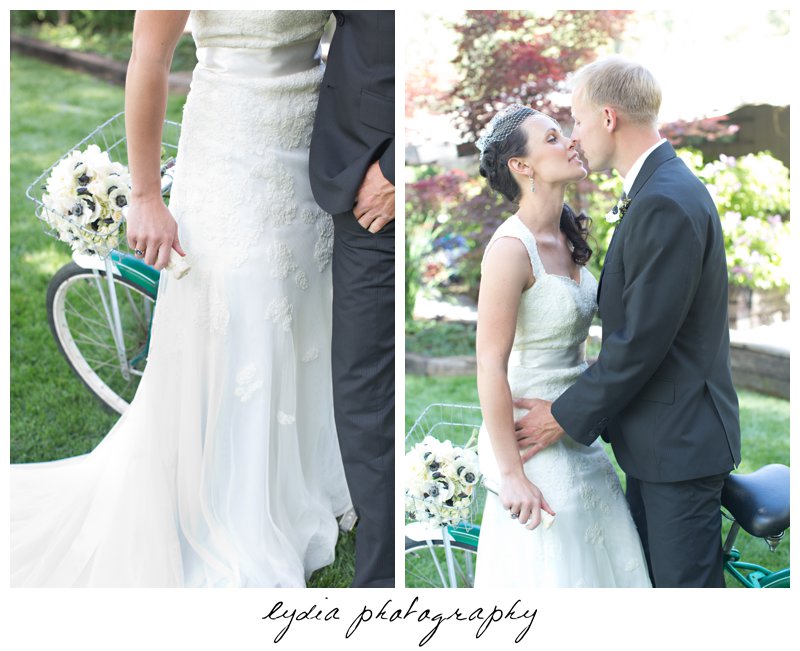 Bride and groom kissing on a vintage bike at wedding at the Roth Estate in Nevada City, California