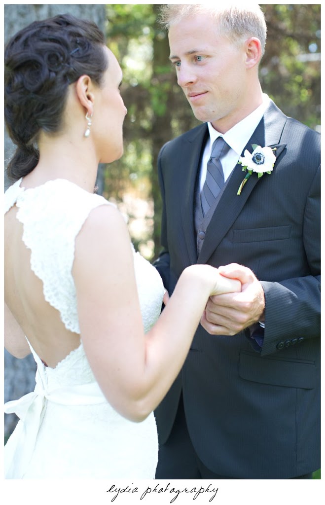 Groom and bride holding hands at vintage wedding at the Roth Estate in Nevada City, California