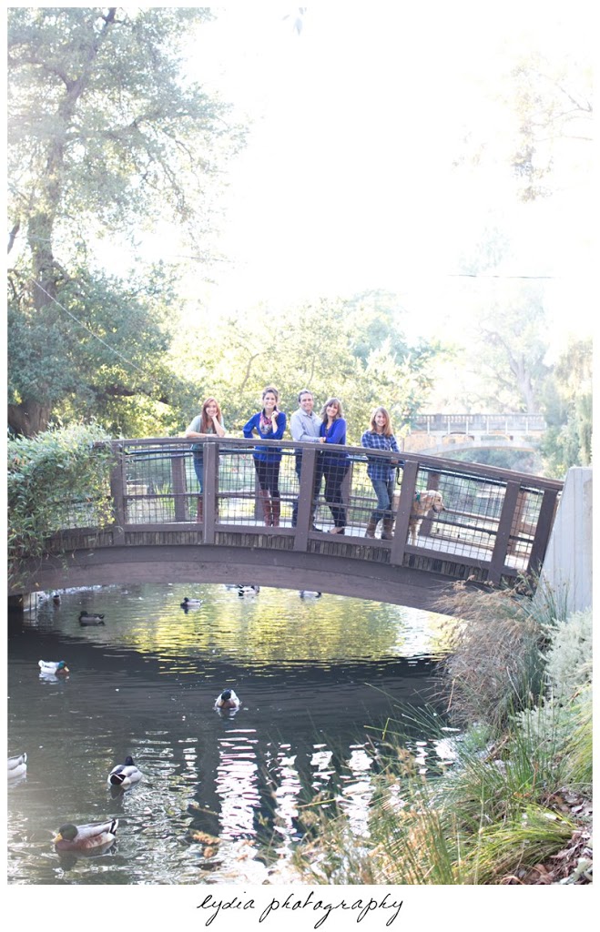 Family on bridge portraits at the UC Davis Arboretum in California.