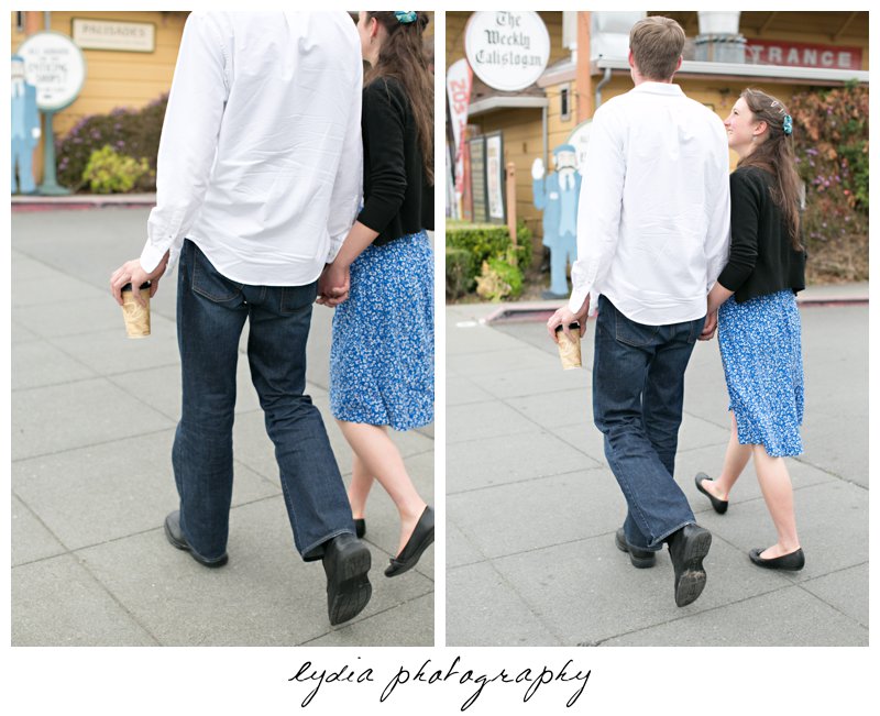 Bride and groom walking with coffee cups engagement portraits in Calistoga, California in Napa Valley