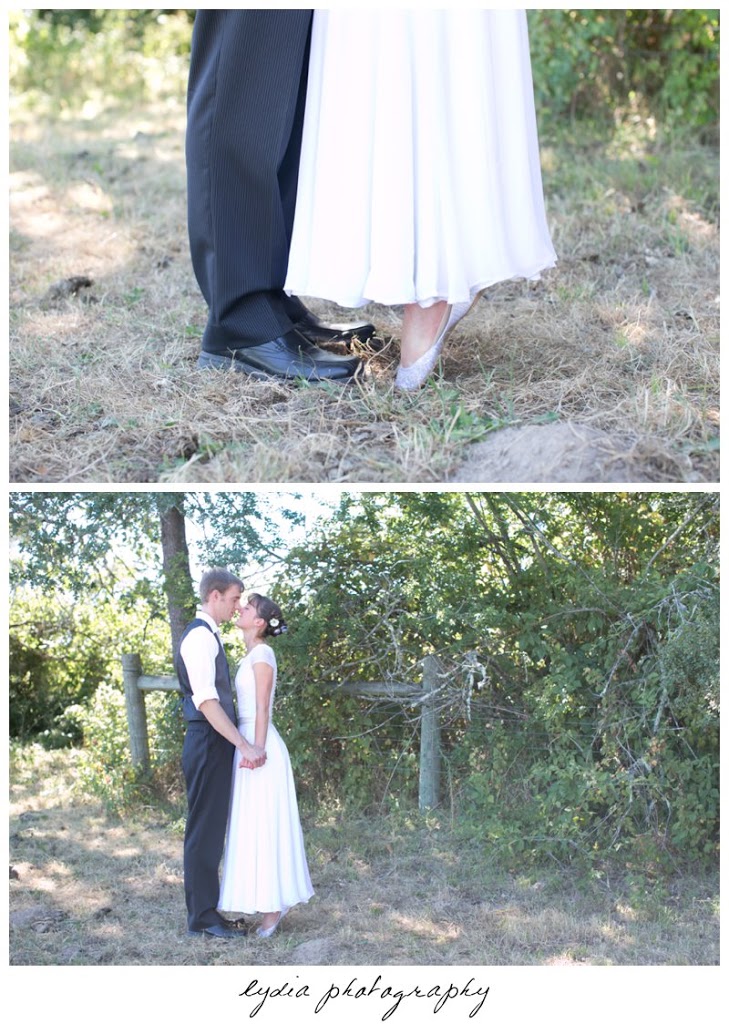 Bride and groom kissing at vintage travel barn wedding in Sebastopol, California