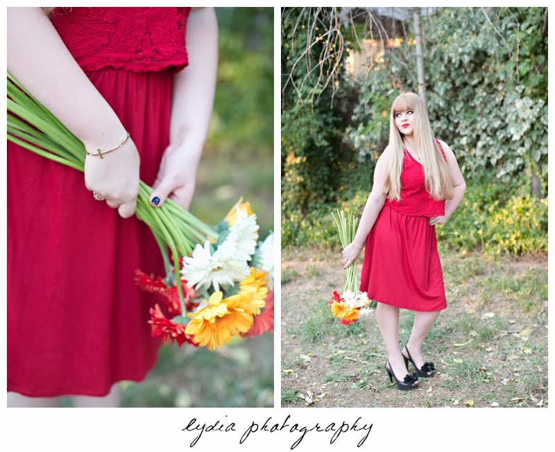 Holding daisies for vintage fashion senior portraits at Empire Mine in Grass Valley, California