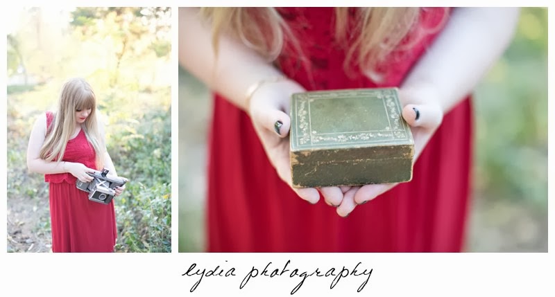Holding a box for vintage fashion senior portraits at Empire Mine in Grass Valley, California