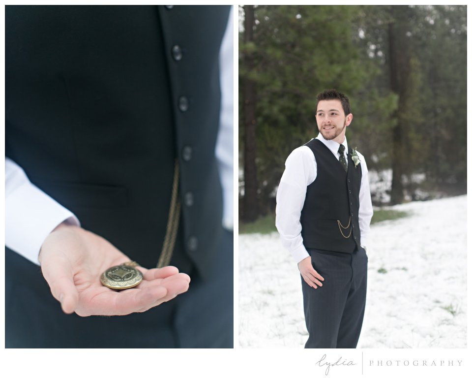 groom holding pocketwatch and groom standing in the snow in Grass Valley, California