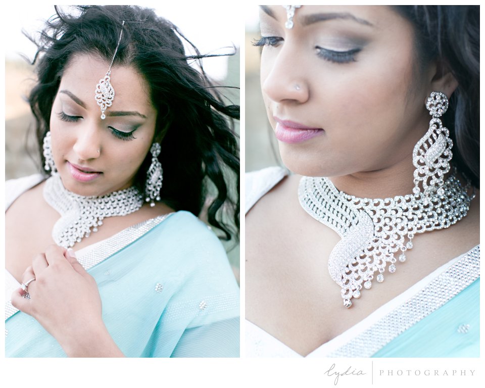 Indian bride wearing turquoise sari and silver bindi and jewelry
