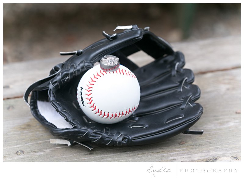 Baseball glove with rings on the ball at elegant vintage style wedding in Grass Valley, California