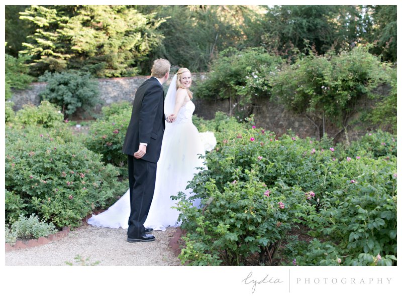 Bride and groom at the rose garden at Empire Mine fairytale wedding in Grass Valley, California 