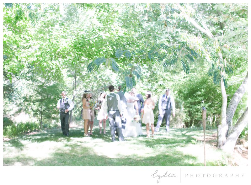 Bridesmaids and groomsmen at a garden wedding at Schrammsbreg Estate in Grass Valley, California
