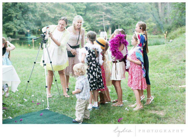 Kids at the photobooth at a garden wedding at Schrammsberg Estate in Grass Valley, California