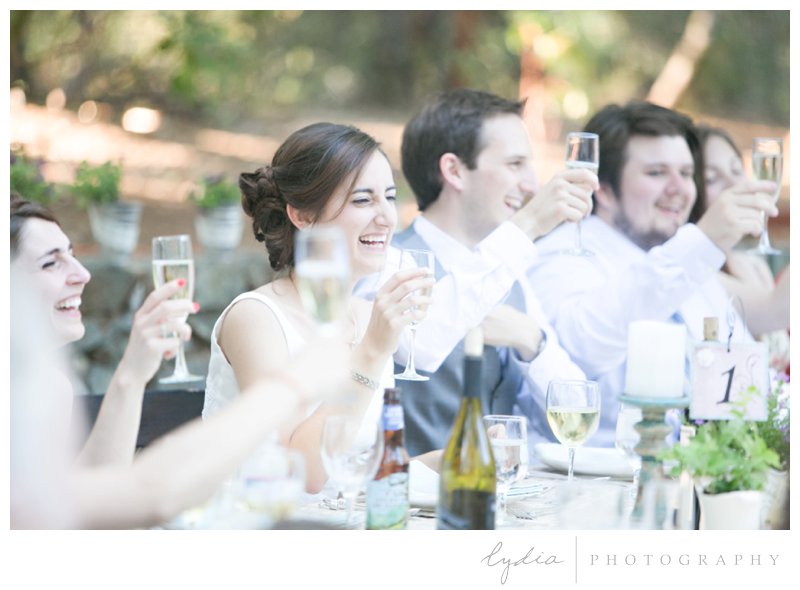 Bride and groom toast for a garden wedding at Roth Estate, in Grass Valley, California 