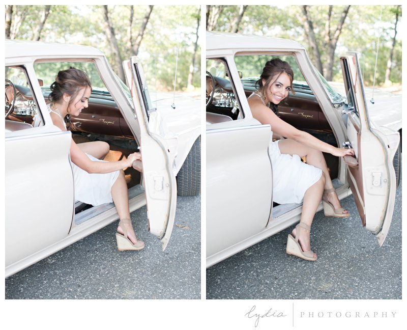 Bride getting out of the vintage car for a vintage Lucchesi Vineyards wedding in Grass Valley, California.