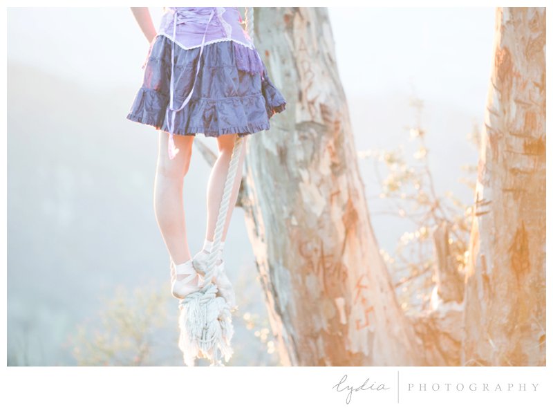 Pointe shoes on the swing at sunset for ballerina pictures at Knapp's Castle in Santa Barbara, California.