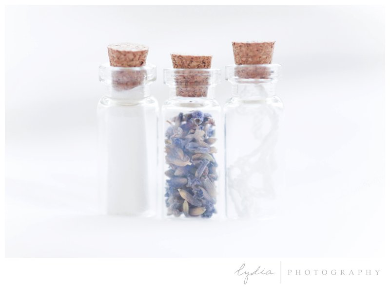 Vials to hold treasure keepsakes for wedding heirloom box for brides and grooms' pictures in California.