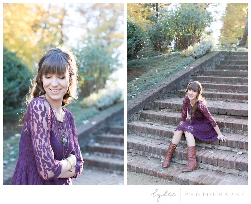 Grass Valley photographer sitting on brick steps for lifestyle portraits at Empire Mine in California.