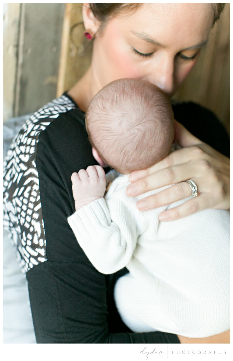 Baby with mother for a Sacramento lifestyle newborn photography in Roseville, California