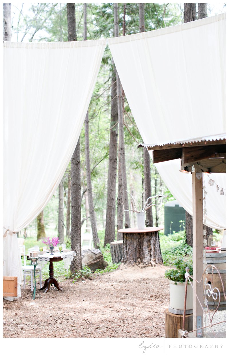 Curtain draping for a forest barn wedding in Grass Valley, California.