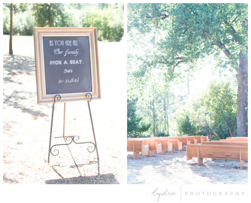 Chalk board seating sign and church pew's at North Star House wedding in Grass Valley, California. 