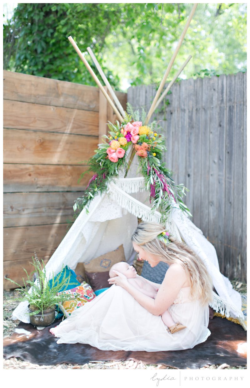 Baby at the flowered tepee at southwest boho newborn inspiration in Grass Valley, California.