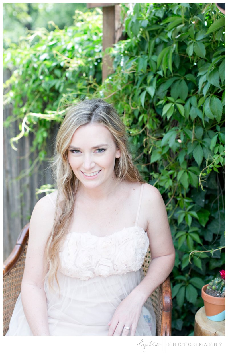 Bride sitting in a chair at southwest boho wedding inspiration in Grass Valley, California.