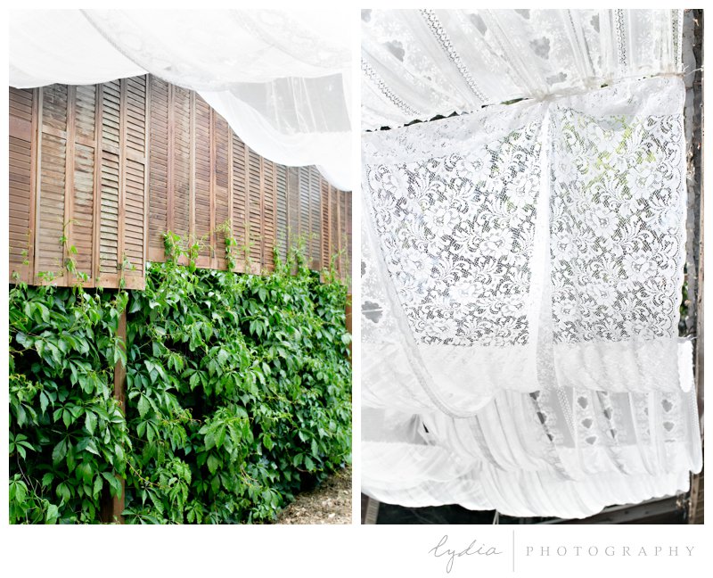 Curtain draping with a wooden fence at southwest boho wedding inspiration in Grass Valley, California.