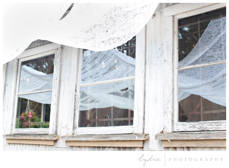 Curtain window decoration at southwest boho wedding inspiration in Grass Valley, California.
