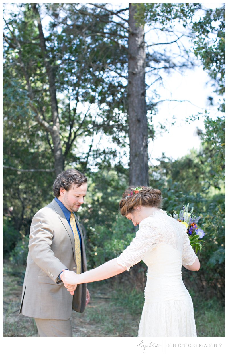 Bride and groom's first look at Grass Valley garden wedding in Chicago Park, California.