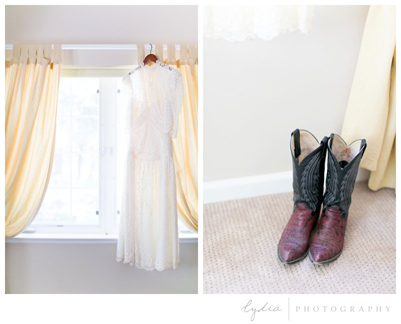 Vintage lace dress and cowboy boots at rustic garden wedding in Chicago Park, California.